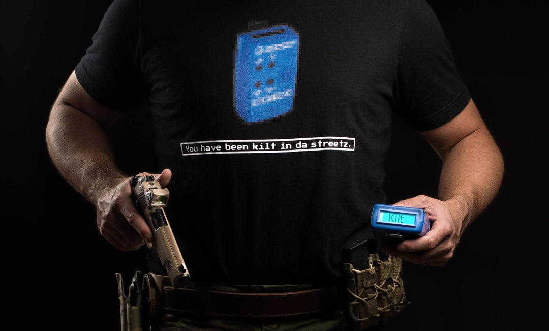 Man holding a shot timer in one hand and a handgun in the other.