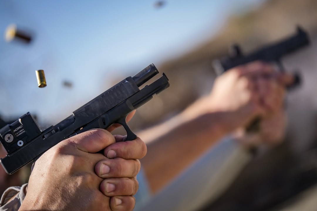 Demonstration of bullet casing being ejected from a handgun.