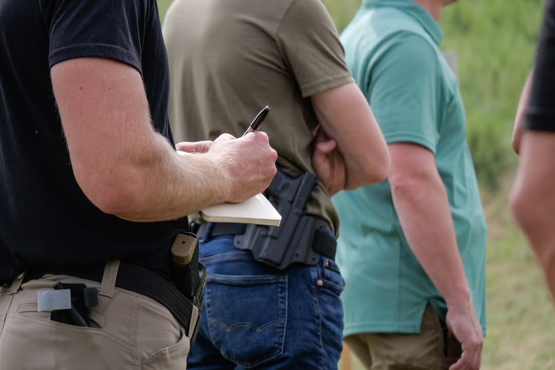 Man taking notes during a shooting training class.