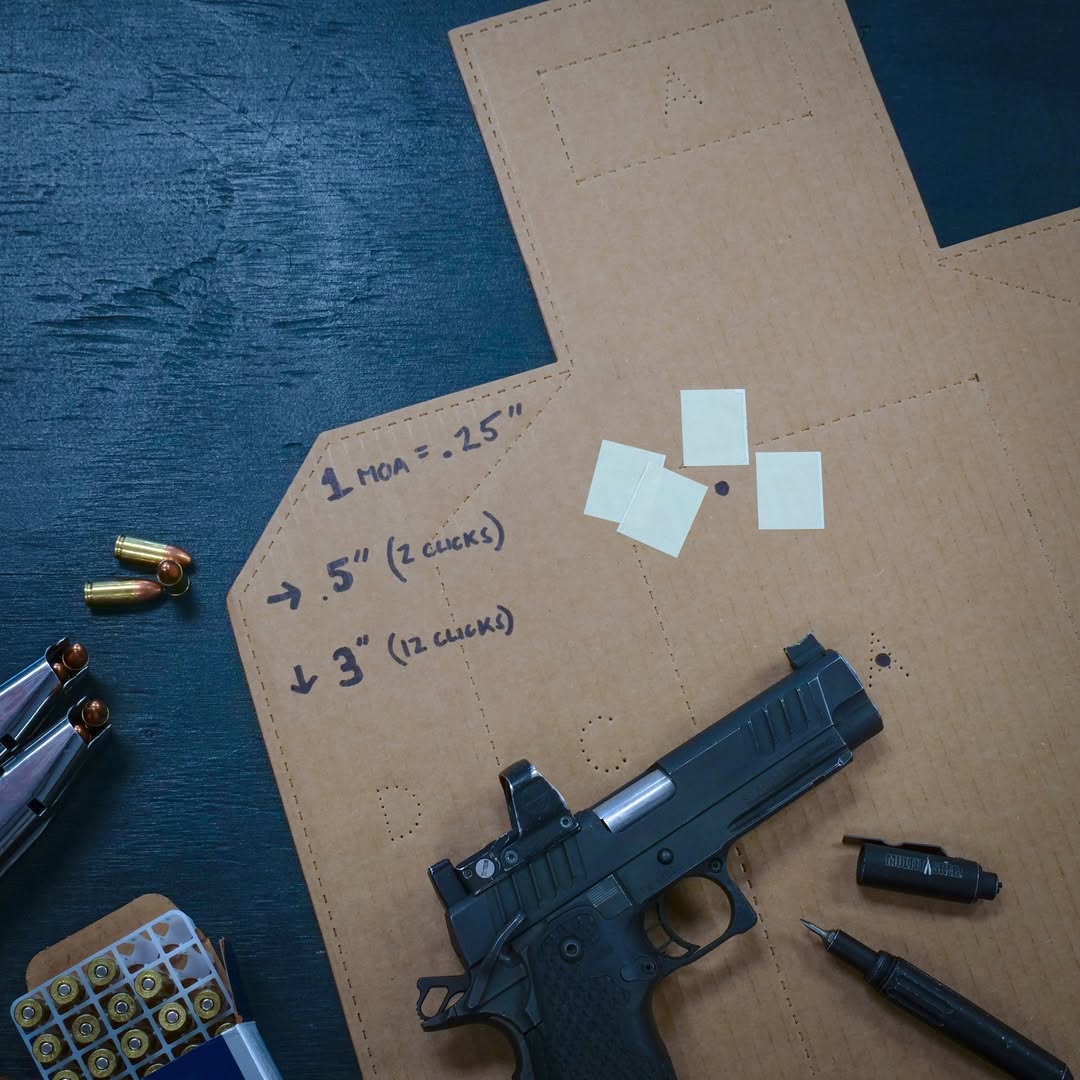 Cardboard IPSC shooting target with measurements of where shots have landed for training purposes.