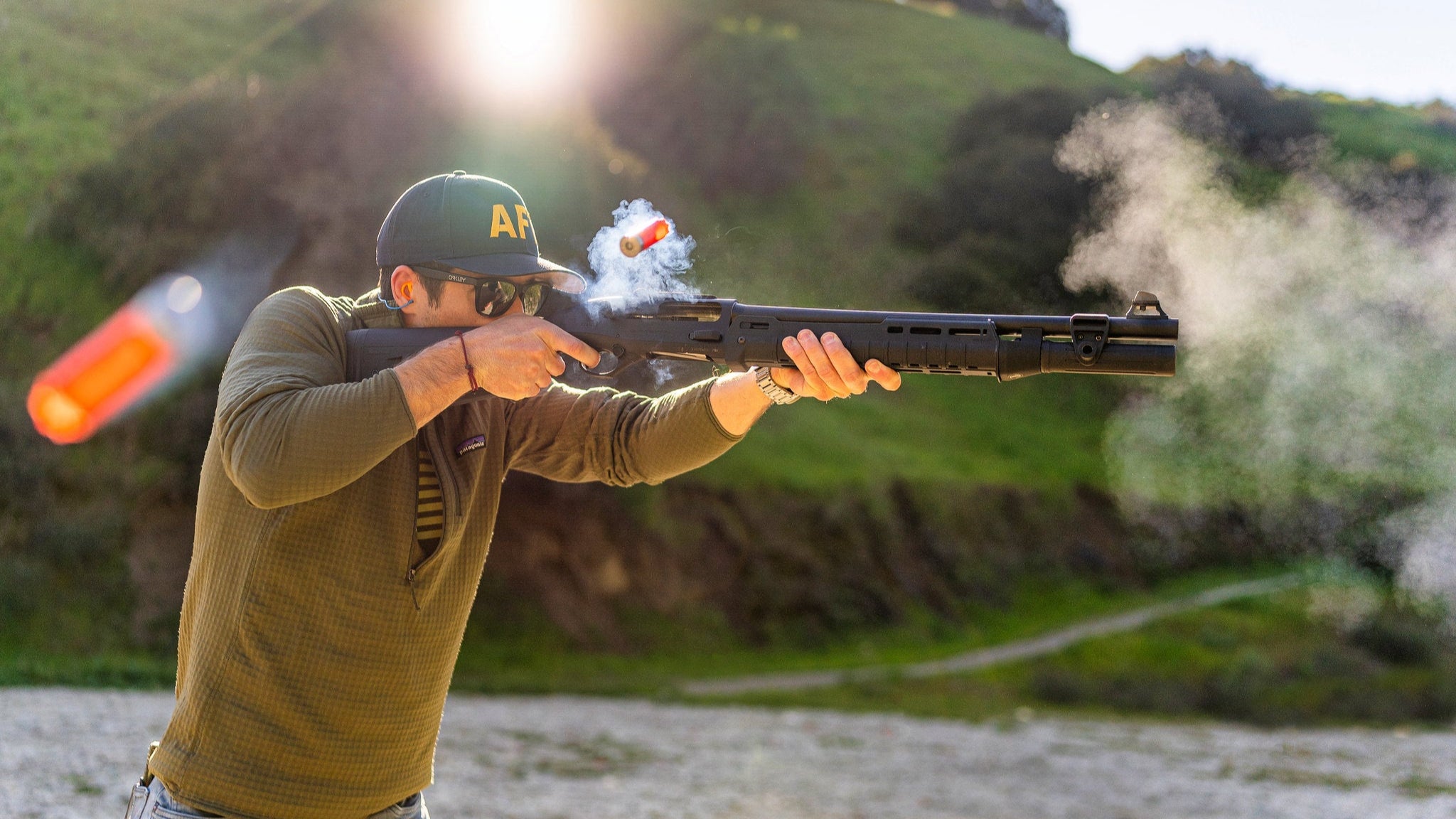 Reloading and firing a semi-automatic shotgun during a home self defence shooting class.